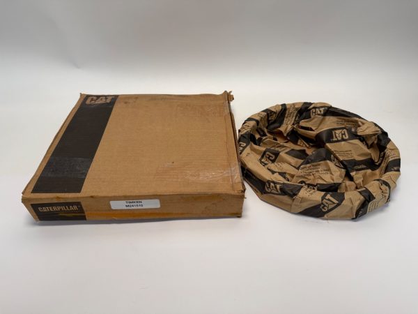 Timken M241510 tapered roller bearing cup wrapped in Caterpillar paper beside its original Cat box