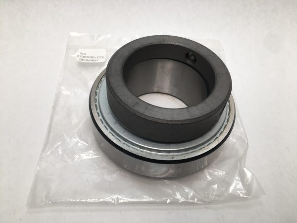 INA E70KRRS insert ball bearing with eccentric locking collar, sitting on its plastic packaging