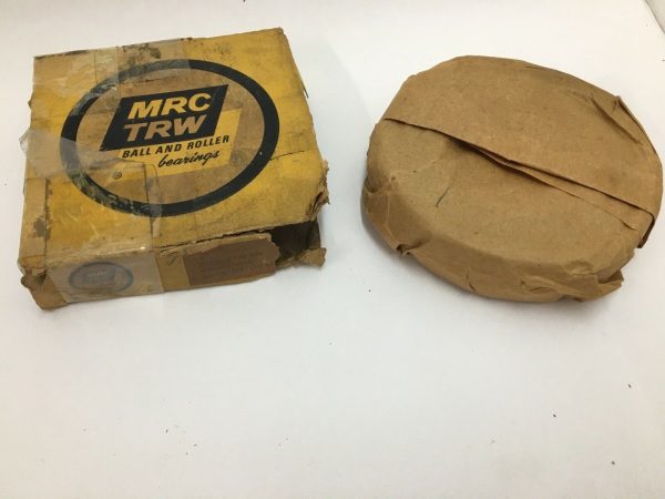MRC TRW angular contact ball bearing in original yellow box beside paper-wrapped bearing