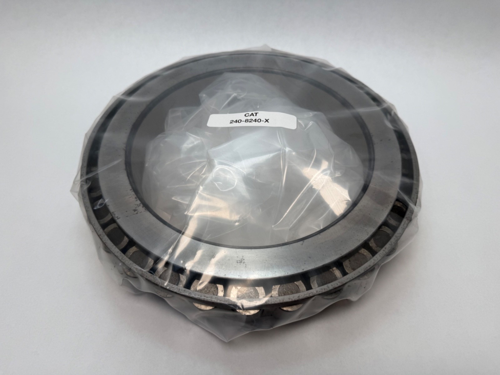 Tapered roller bearing cone with rollers and cage, shrink-wrapped, labeled CAT 240-8240-X