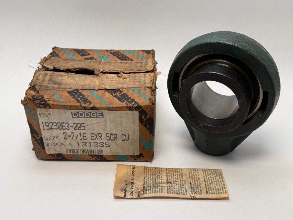 Dodge SCHB-SXR-207 screw conveyor hanger bearing with 2-7/16 in shaft next to its original box and manual