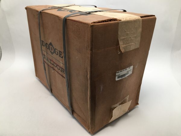 Sealed cardboard box with Dodge Baldor branding, strapped shut, containing the CH4S-517-USAF pillow block housing