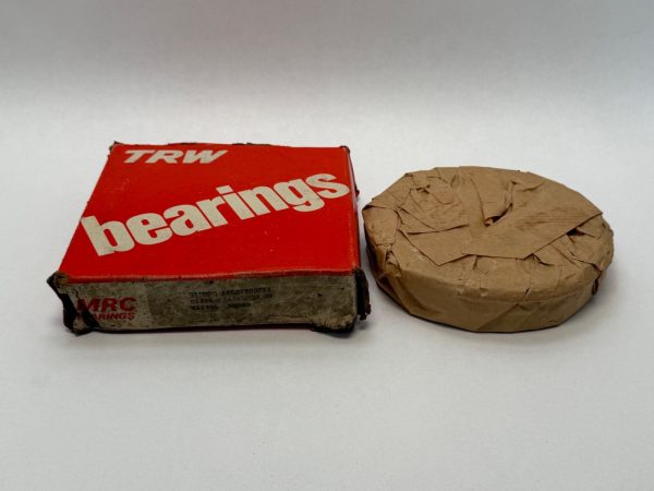 MRC 312MFG ball bearing wrapped in paper beside its TRW MRC Bearings box