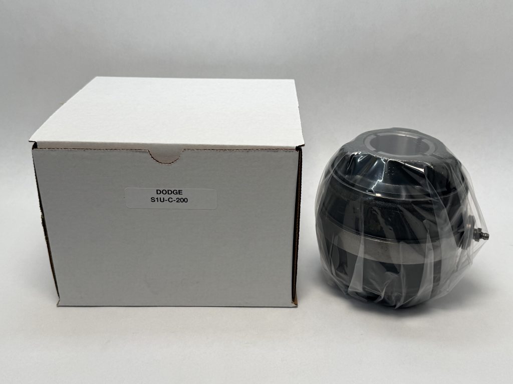 Dodge S1U-C-200 insert bearing, 2 in bore, shrink-wrapped, next to its labeled packaging box