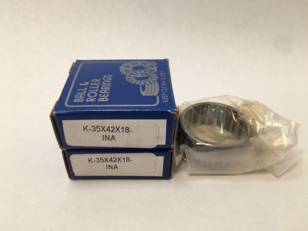 Two boxes labeled K-35X42X18-INA beside an unwrapped needle roller and cage bearing assembly