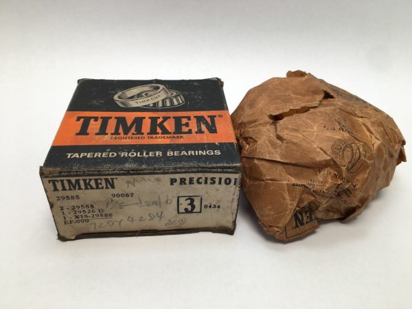 Timken 29585-90067 tapered roller bearing assembly box next to wrapped bearing in paper