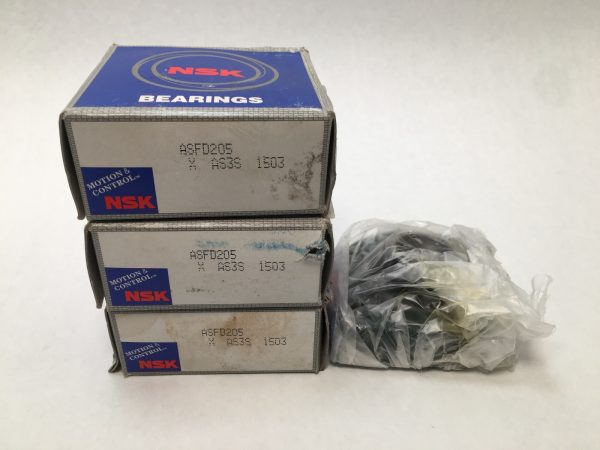 Three stacked NSK ASFD205 bearing unit boxes beside a plastic bag containing a flange bearing unit